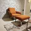 Rolf Benz Jon fauteuil met poef - Showroom