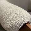 Leolux Cream fauteuil met poef - Details